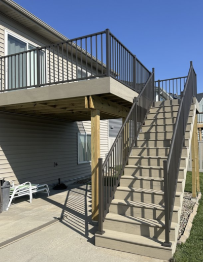 Large, newly constructed composite deck with black railing